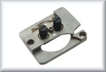 Engine plate complete with brush guide and brush heads, grey, made from zinc cast, price per piece.